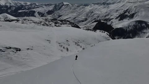 Aerial view of man is freeriding in Caucasus mountains, Gudauri, Georgia. Stock Footage 320209624