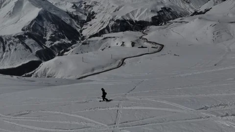 Aerial view of man is freeriding in Caucasus mountains, Gudauri, Georgia. Stock Footage 320210199
