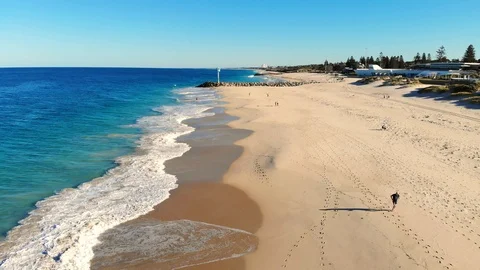 Aerial View of a Man Jogging on Beach Stock Footage 116244768