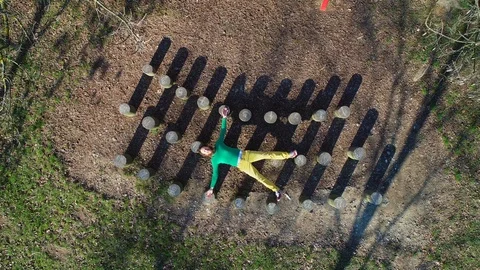 Aerial view of man laying down over wooden stumps, Zagreb, Croatia. Stock Footage 102165933