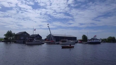 Aerial view of man rowing a row boat along the canal, Netherlands Stock Footage 85011387