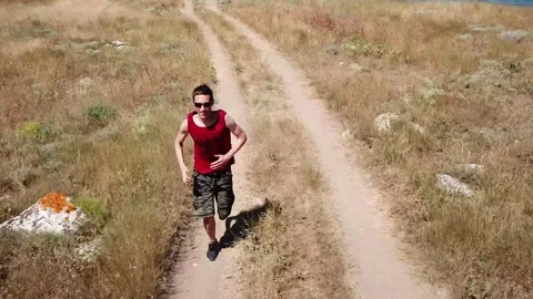 Aerial view. Man is running along general's beaches, Autumn in Crimea Stock Footage 321379468