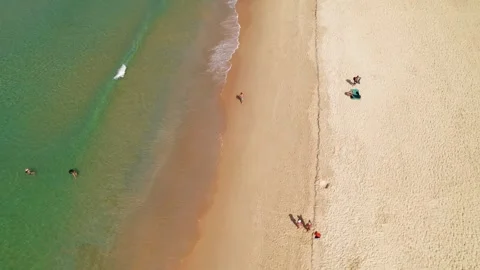 Aerial view, man running through Karon beach, turquoise water, coastline, drone Stock Footage 245225863