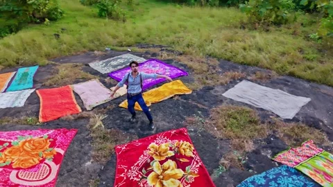 Aerial view man stand posing on rock looking above outdoor Stock Footage 304848829