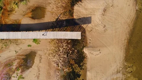 Aerial view of man standing on the edge of wood pier, Estonia. Stock Footage 101571493