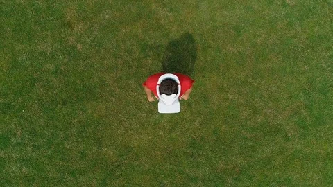 Aerial view of man with a VR headset on his head Stock Footage 114483380