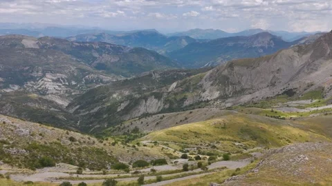 Aerial View of Man Walking Alone Through Mountains Stock Footage 338006717