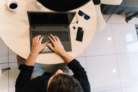 Aerial view of a man working remotely on his laptop Stock Photos