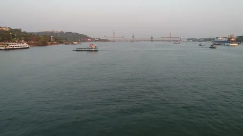 Aerial view on Mandovi river, small ferryboat floats from shore to shore. Stock-Footage 85547323
