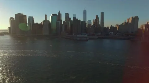 Aerial view of Manhattan at sunset. Camera moving slowly backwards Manhattan. Stock Footage 58569445
