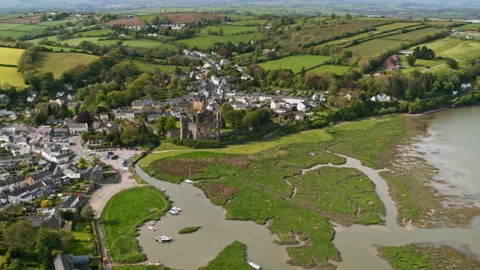 Aerial view of Manorbier Castle and village in Wales Stock Footage 336773370