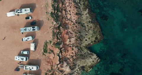Aerial view of many camper vans on a parking lot. Aerial Footage of Scenic Sea Vídeos de archivo 133243749