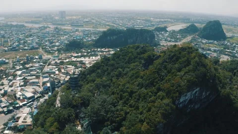 Aerial view of Marble Mountains in Da Nang, Pagoda temples in Vietnam 4K Stock Footage 242399759