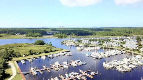 Aerial view of marina with lighthouse in South Carolina. Stock Footage