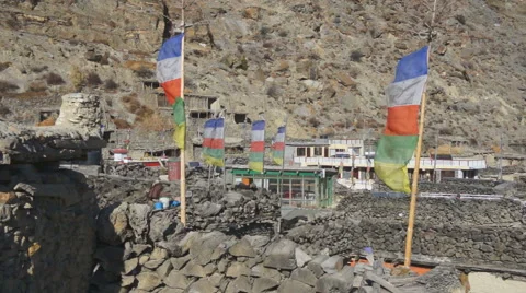 Aerial view of Marpha with flags fluttering in the wind, Nepal Stock Footage 56892041