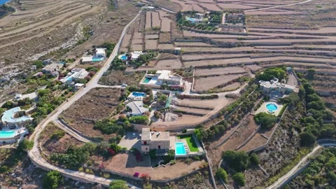 Aerial view of Mġarr ix-Xini valley, Gozo, with farms and villas in summer Stock Footage 341712791
