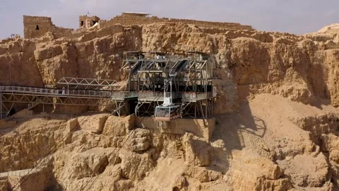 Aerial view of Masada cable car station and arriving tramway cabin Stock Footage 340546069