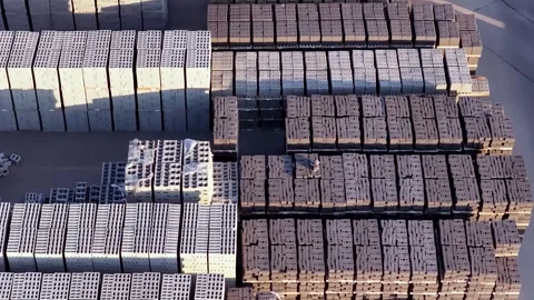 Aerial View of Masonry Block and Retaining Wall Stacks at Sunrise in Industrial Stock Footage 341677239