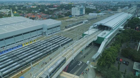 Aerial View of Mass Rapid Transit Jakarta Entering Lebak Bulus Station Stock Footage 129880837