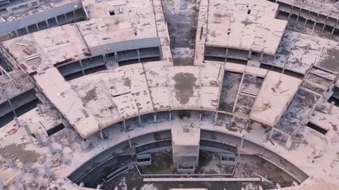 Aerial View of Massive Abandoned Commercial Building Roof with Exposed Cables Stock Footage 323915376