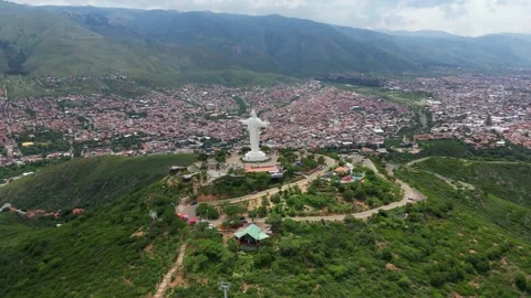 Aerial view of the massive Cristo de la Concordia statue on San Pedro Hill in Stock Footage 341316484
