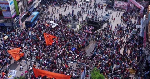 Aerial view of massive crowd dancing joyfully during immersion of lord Ganesh Stock Footage 340083931