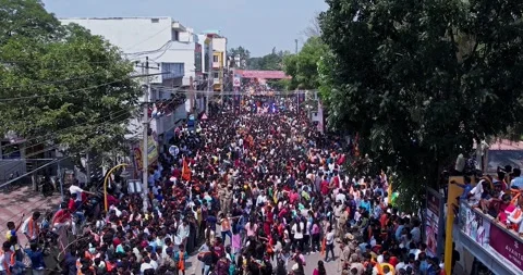 Aerial view of Massive Crowd Dancing Joyfully During Vibrant Ganesha Immers.. Stock Footage 340084146