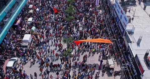 Aerial view of massive crowd dancing joyfully during immersion of lord Ganesh Stock Footage 340084387