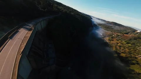 Aerial view of a massive dam cutting through a valley at Castelo de Bode Stock Footage 342272862
