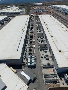 Aerial view of a massive data center facility and cooling systems Stock Photos