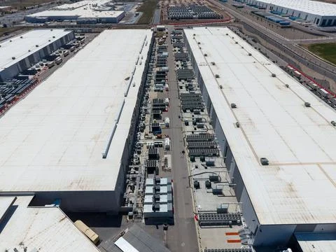 Aerial view of a massive data center facility and cooling systems Stock Photos