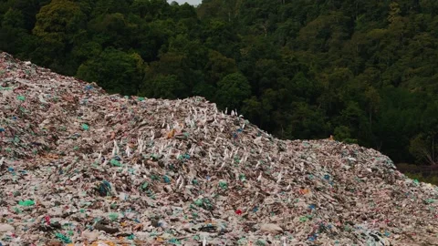 Aerial view of massive garbage on langkawi rainforest terrain, exposing critical Stock Footage 308447273