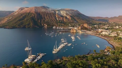 Aerial view of massive Gran Cratere volcano on Vulcano island during golden Stock Footage 341685790