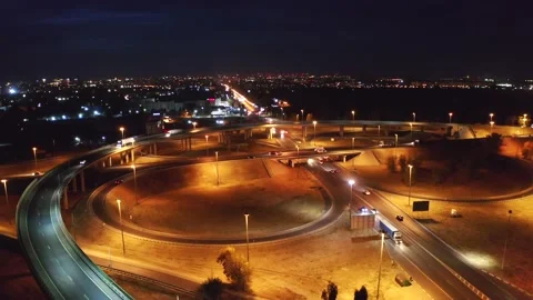 Aerial view of massive highway intersection with bridges and car traffic at Stock Footage 143876290