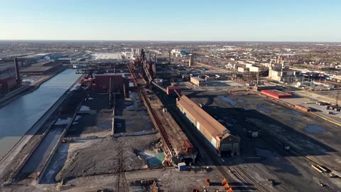 Aerial view of a massive, industrial complex with rusted structures and rai.. Video stock 333602602