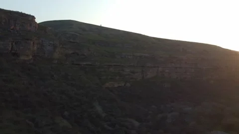 Aerial view of massive layered sedimentary cliffs and steep slopes in Kazakhstan Vidéo 337424868