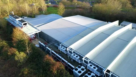 Aerial view of a massive Milton Keynes data center specializing in quantum Stock Footage 333021742