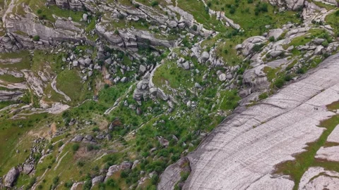 Aerial View of Massive Rock Formations in Green Mountain Valley Stock Footage 344161884