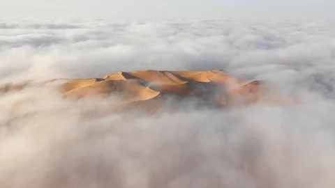 Aerial view of massive sand dunes in thick fog. Stock Footage 126283091