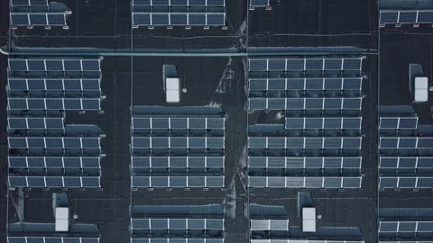 Aerial view of massive solar panel roof setup. Industrial scale green energy.  Stock Footage 125395450