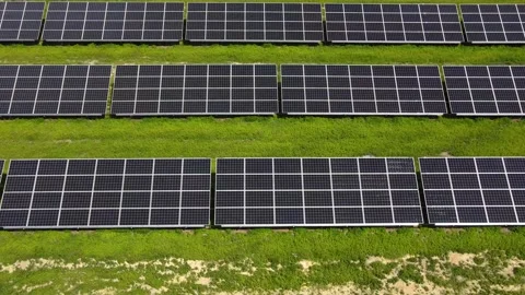 Aerial view, massive Solar panel farm on the field, alternative energy Vidéo 221077416