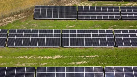 Aerial view, massive Solar panel farm on the field, alternative energy Vidéo 221078621