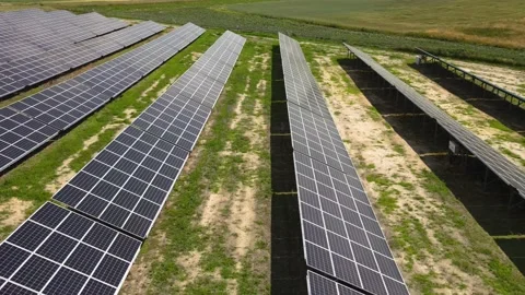 Aerial view, massive Solar panel farm on the field, alternative energy Vidéo 221079354