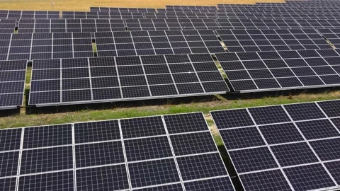 Aerial view, massive Solar panel farm on the field, alternative energy Vidéo 221079406
