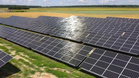 Aerial view, massive Solar panel farm on the field, alternative energy Vidéo 221079443