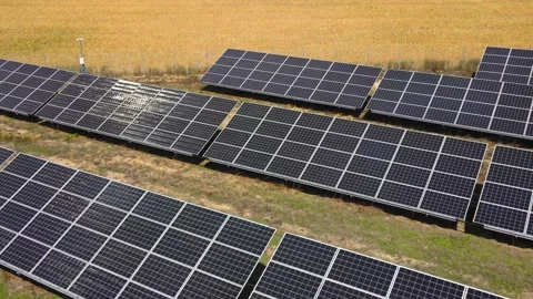 Aerial view, massive Solar panel farm on the field, alternative energy Vidéo 221079518