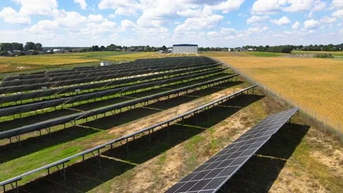 Aerial view, massive Solar panel farm on the field, alternative energy Vidéo 221079560