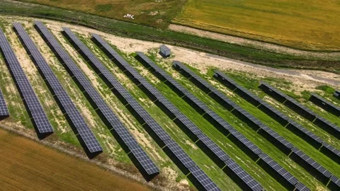 Aerial view, massive Solar panel farm on the field, alternative energy Vidéo 221079692