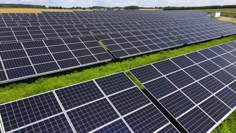 Aerial view, massive Solar panel farm on the field, alternative energy Vidéo 221079765