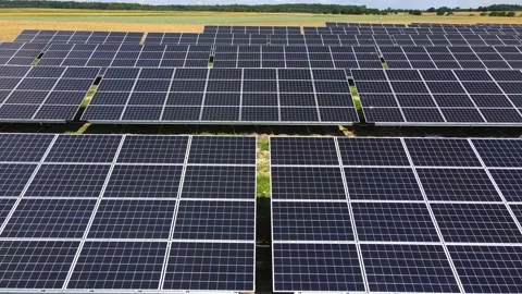 Aerial view, massive Solar panel farm on the field, alternative energy Vidéo 221079775